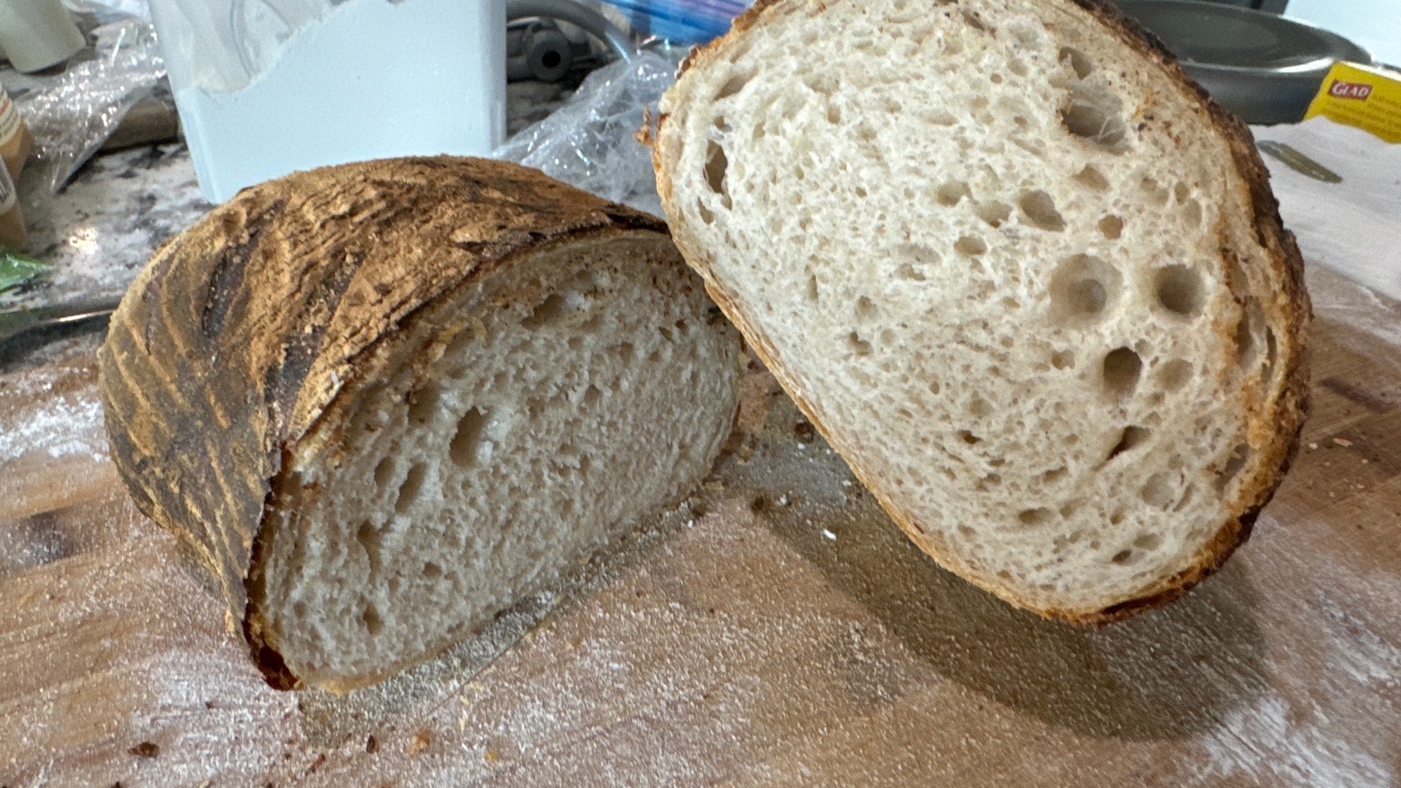 A sliced loaf showing the interior crumb beneath a browned crust